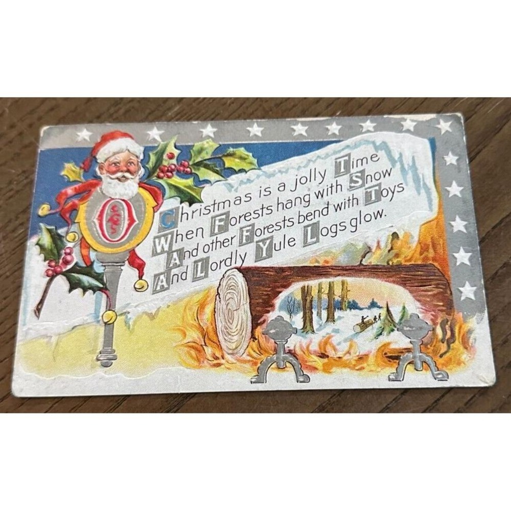 1911‎ Antique Embossed M.L. Jackson Christmas Santa Log Fire Postcard USED